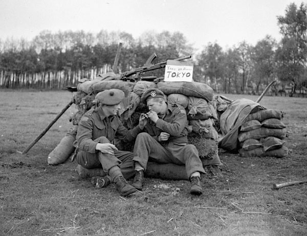 Canadian Soldiers pose at news of surrender