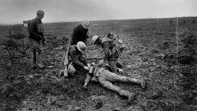More soldiers look over dead German